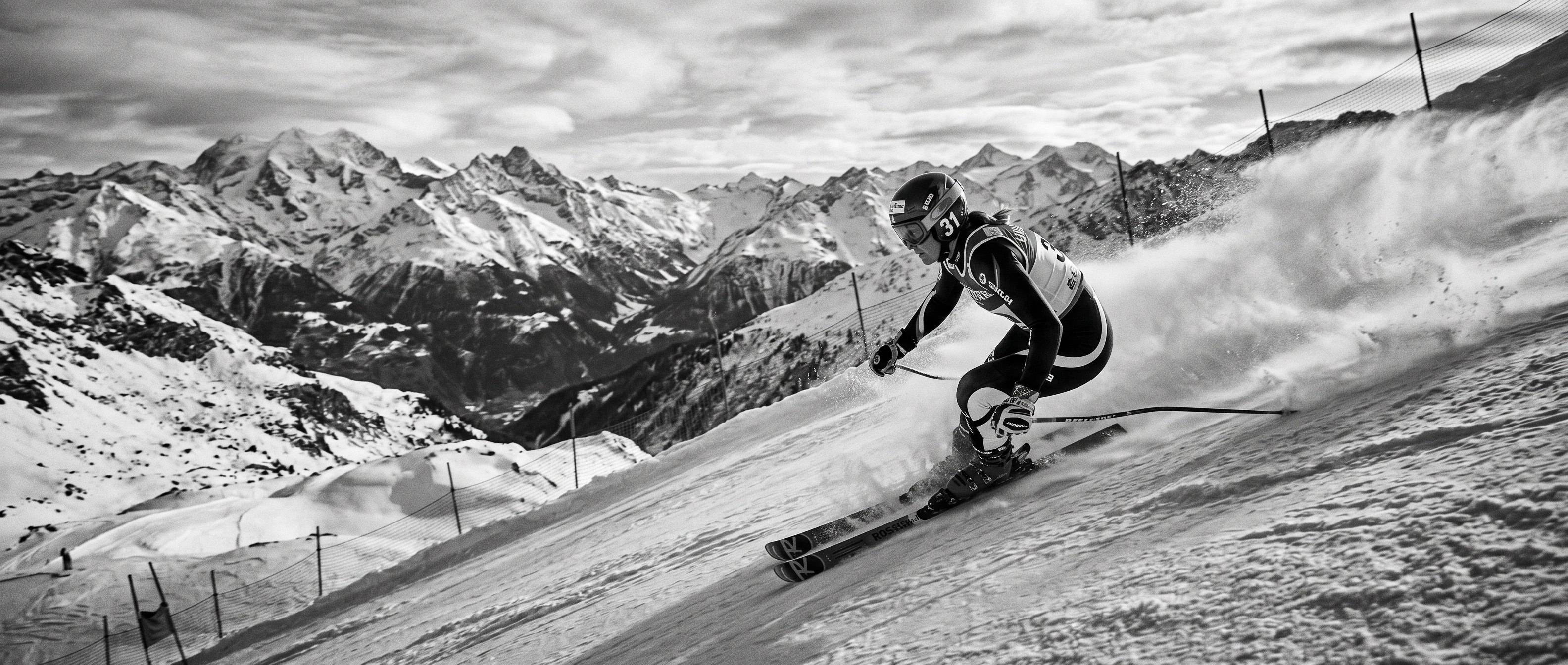 Female alpine ski racer carving down a slope